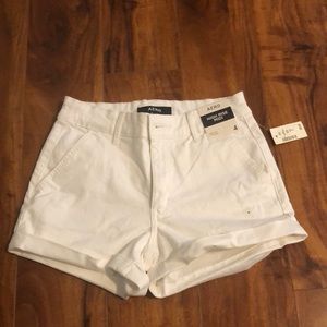 NWT high rise midi shorts in size 4, white